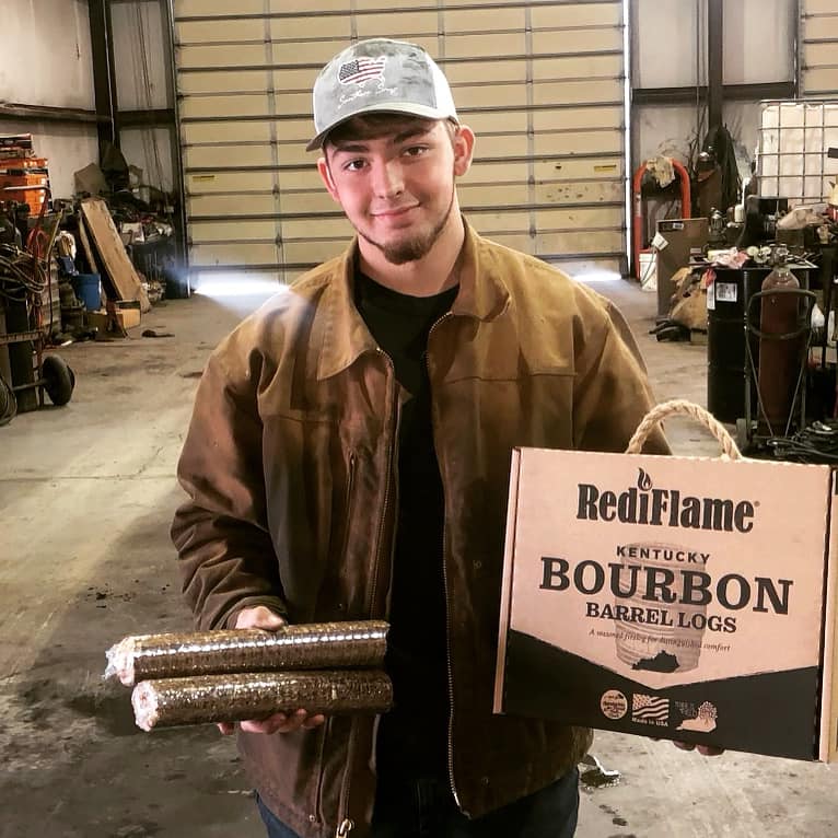 Young man with bourbon logs